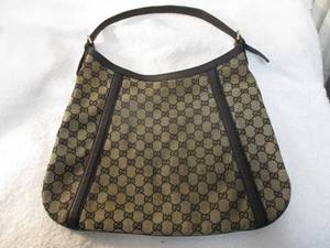 lot 105 image: GUCCI- Top Handle- GG Coated Canvas Bag, With Leather Handle