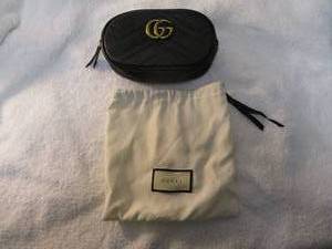 lot 106 image: GUCCI- GG Black chevron leather belt bag  Clutch, and Dust Bag