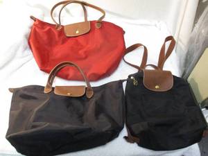 lot 108 image: 3-LONGCHAMP BAGS-1-Black Le Pliage Backpack,(2)1-Black-Short Handle and 1-Red-Long Handle Canvas Shopping Tote Bags