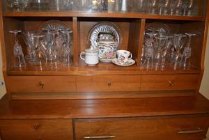 lot 28 image: Glassware on Bottom Shelf of Hutch Including Royal Windsor Tea Cup and Teapot with Brass Handle