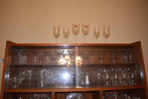 lot 27 image: Glassware on Top Shelves of Cabinet Includes Cream and Sugar Sets and a Variety of Glasses