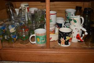 lot 34 image: Brass Taper Candle Holders, Glasses and Mugs as shown