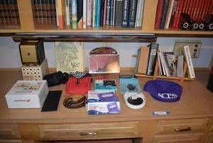 lot 64 image: Contents on Cabinet Includes TomTom, Vintage Playing Card Shuffler, Surface Fish-n-Temp and More