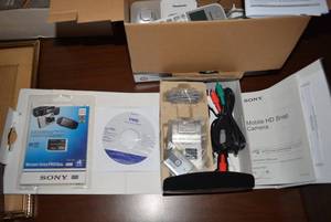 lot 78 image: Mobile HD Snap Camera still in Box, Sony Memory Stick 4GB and Panasonic Cordless Phone Set