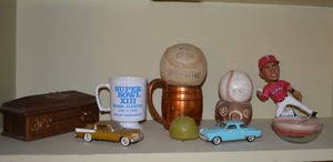 lot 107 image: Contents on Shelf Studebaker Model Cars, Elvis Andrus Figurine, Baseball and More