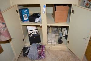 lot 114 image: Contents of Cabinet Leather Belts, Phones, BP Cuff, BP Monitor and More