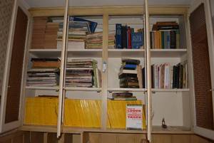 lot 133 image: Books and Magazines in Bookshelf National Geographic, Bibles, Recipes and More