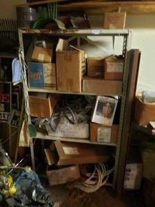 lot 324 image: Contents of Shelf Outdoor Brass Light, Garden Hoses, Gloves, and More