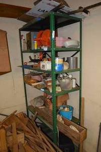 lot 294 image: Top 3 Shelves of Green Rack Extension Cord, Finish Sander, Electric Chain Saw box