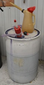 lot 69 image: 50 gallon plastic drum of winsheild washer fluid about 23s full