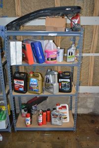 lot 104 image: Contents of Shelf Mustang Grill, Antifreeze, Oil, Coolant, Air Filter, See pictures