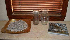 lot 27 image: Cowboys Stadium Book by Rizzoli, Glass Centerpiece with polished Rocks and 2 Vases