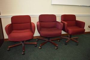 lot 40 image: 3 Red Cushioned Office Chairs Wood and Metal Base