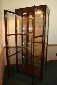 lot 44 image: Lighted Glass Shelf Hutch, Cherry Finish