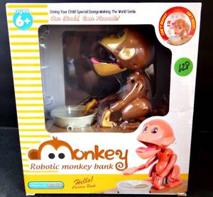 lot 128 image: Monkey Stealing Money Box Coin Bank,Robotic Munching Toys Saving Bank - NEW