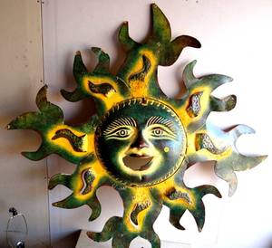 lot 230 image: VERY LARGE METAL AND CLAY SUN. COLORFUL - SOME DAMAFE AS SEEN IN PIC 3 - OVER 3 FT TALL