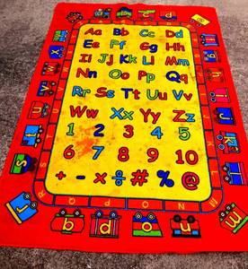 lot 245 image: COLORFUL CHILDRENS RUG (NEEDS CLEANING) - MEASURES APPROX 5 X 8