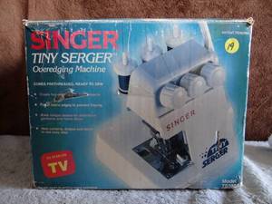 lot 19 image: Singer Tiny Serger Electric Overedging Machine - (TS380A) - In Original Box