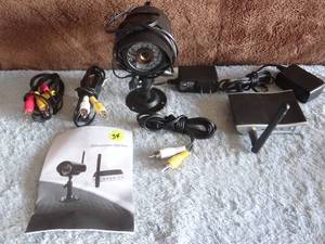 lot 34 image: SECURITY CAMERA WITH TRANSMITTER, CABLES, AND MANUAL AS SHOWN