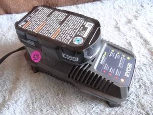 lot 53 image: RYOBI INTELLIPORT CHARGER AND 18V LITHIUM BATTERY
