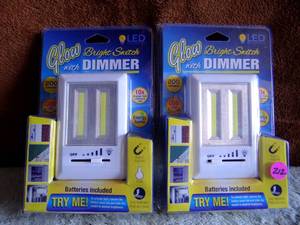 lot 212 image: Glow Bright Switch With Dimmer LED Mounts 3 Ways Batteries Included X 2