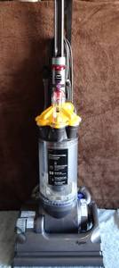 lot 233 image: Dyson DC33 Multi Floor Bagless Vacuum Cleaner WAttachments  as shown - Yellow Used