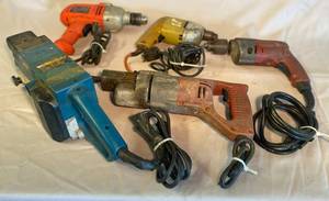 lot 29 image: Black & Decker Drill, Milwaukee Drill, yellow Drill, Ryobi 3 Belt Sander and Milwaukee hammer drill