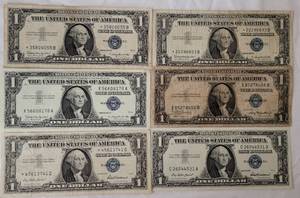 lot 46 image: LOT OF 6 ONE DOLLAR BLUE SEAL SILVER CERTIFICATES INCLUDING (1) 1935A, (2) 1957, AND (3) 1957B AS SHOWN. (YOUR BID X 6)
