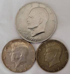 lot 54 image: (1) 1971 ONE DOLLAR COIN AND (2) 1967 HALF DOLLAR COINS AS SHOWN.
