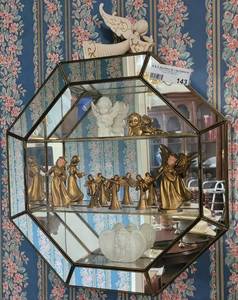 lot 143 image: VINTAGE MIRRORED OCTAGONAL CURIO WITH ASSORTED ANGEL FIGURINES AS SHOWN. Approx. 16 x 16 x 3.75.