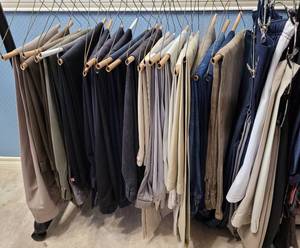 lot 212 image: LOT OF ASSORTED DRESS PANTS AS SHOWN. OVER 20 PIECES