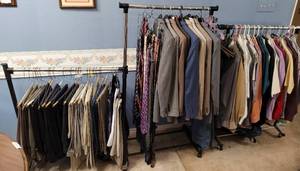 lot 216 image: LOT OF 2 CLOTHING RACKS WITH WHEELS AS SHOWN. (YOUR BID X 2) CONTENTS NOT INCLUDED