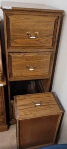lot 233 image: WOODEN 4-DRAWER FILE CABINET AS SHOWN. ONE DRAWER RAIL NEEDS REATTACHED.
