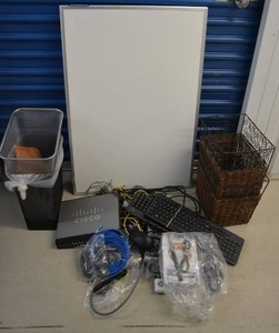 lot 25 image: Misc. Office Supplies Surge Protector, White Board, Cisco 24-Port Switch Box