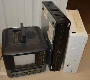 lot 28 image: 5 12 Color TV with VCR, Gemini Security System by Napco, and Direct TV Box