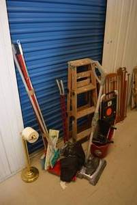 lot 34 image: Cleaning Supplies Tretle Brackets, Brooms, Sweepers, Vacuum, Step Ladder, Bathroom Tissue Holder