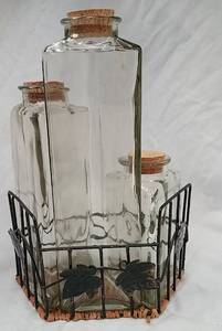 lot 81 image: 3 Triangular Glass Bottles w Rack