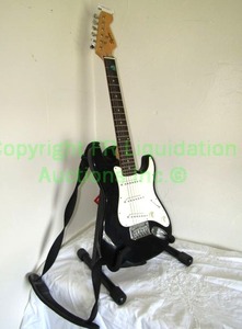 lot 2 image: Squier mini by Fender electric guitar with stand and shoulder strap