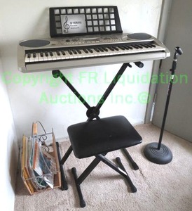 lot 267 image: Yamaha portable keyboard with folding stand, stool, microphone stand and sheet music