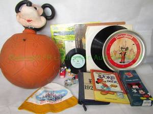 lot 127 image: Vintage Disney collectibles including Mickey Mouse hoppity bounce ball, Joke book, Disneyland cap and more