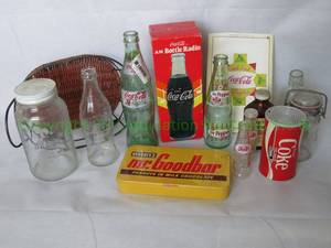 lot 172 image: Coca Cola collectibles including a Mr. Goodbar tin, Coke bottle and can radios and more as shown