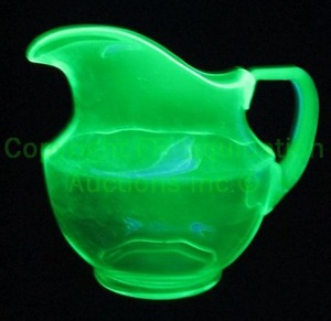 lot 214 image: Mid century uranium oxide depression glass serving pitcher