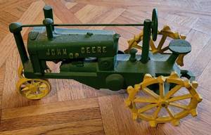lot 37 image: Vintage John Deere Cast Iron OP Collectors Display Tractor as shown.