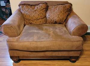 lot 45 image: Leather sofa chair in style, color, and condition shown.