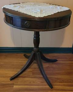 lot 58 image: Vintage drum table with drawer in style, color, and condition shown.
