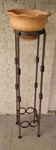 lot 66 image: Tall wrought iron planter holder with pot as shown.