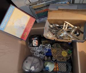 lot 90 image: Cracker Barrel metal tray, cupcake holderstand, flatware, decor and more as shown.