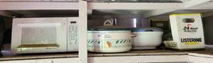 lot 138 image: GE microwave, Rival crockpot, and more as shown.