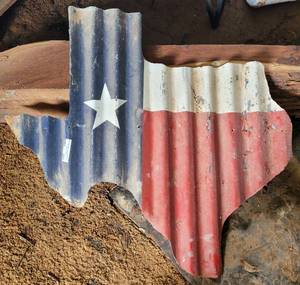 lot 203 image: Corrugated Metal Texas Wall Decor as shown.