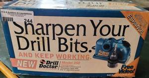 lot 244 image: Drill Doctor Drill Bit Sharpener With Box as shown.